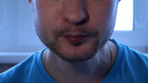 Close-up, man eats, fast food, a national dish, pie, unshaven man Stock Footage 94250178