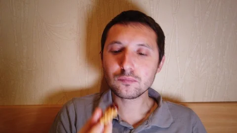 Close-up, man eats, fast food, chicken nuggets, wings and french fries. 4k Stock Footage 119888992