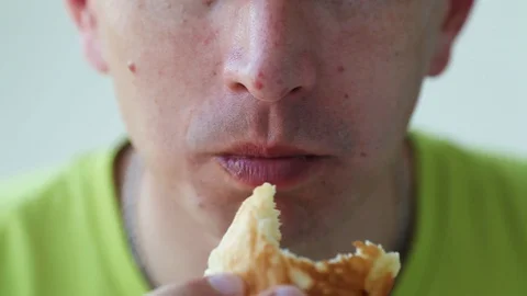 Close up man eats with great pleasure, man eats pancakes Stock Footage 129844835