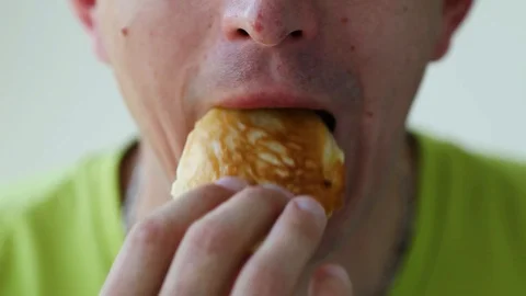 Close up man eats with great pleasure, man eats pancakes Stock Footage 129844961
