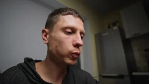 Close up man eats pasta with cheese and salad at home. Stock Footage 316407150