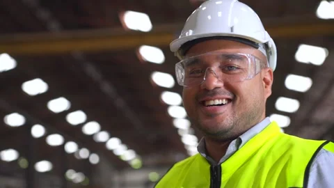 Close up man engineer wearing and adjust protective safety helmet or hard hat. Stock Footage 332119433