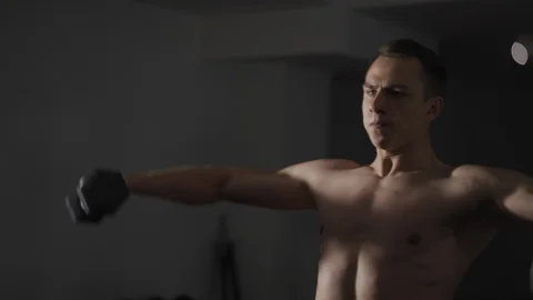 Close up of man exercising with dumbbell Video stock 102734087