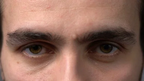 Close-up man eyes looking Stock Footage 74826337