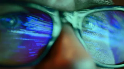 Close up of man eyes looking through glasses at the flashing sliding l Stock Footage 306378643