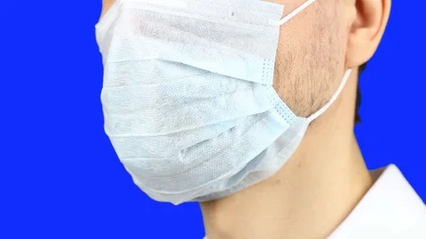 Close-up of man face, remove used medical mask, blue screen chromakey Видео 126998999