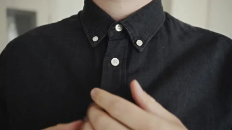 Close-up of man fastening collar button before business meeting Stock Footage 317554337