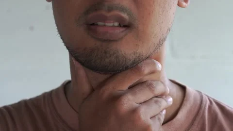 Close up of man feels a cold or flu symptom, a sore throat. Stock Footage 327206372
