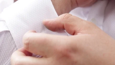 Close-up of man fixing his engraved cuff links. Stock Footage 108268072