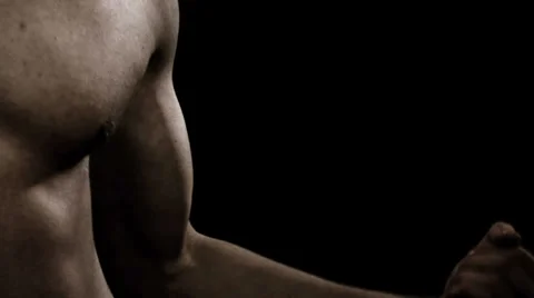 Close up of a man flexing his bicep Stock Footage 33831009