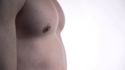 Close up of a man flexing his chest muscles in 4k 動画素材 109534956