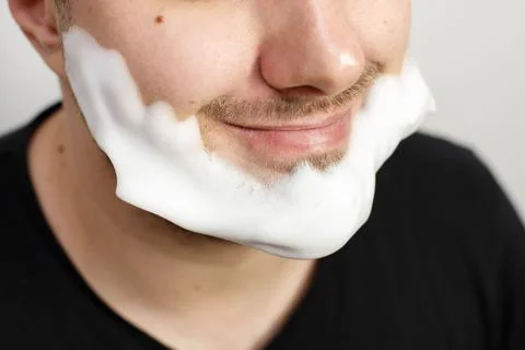 Close up of man with foam on face Stock-Fotos