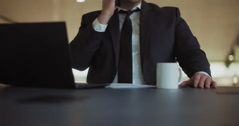 Close up of a man in a formal suit talking on the phone Stock Footage 140201043