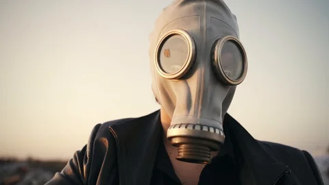 Close-up of a man in a gas mask Stock Footage 128968706