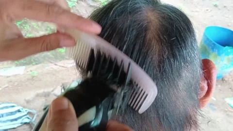 Close-up of a man getting a haircut  스톡 동영상 321936225