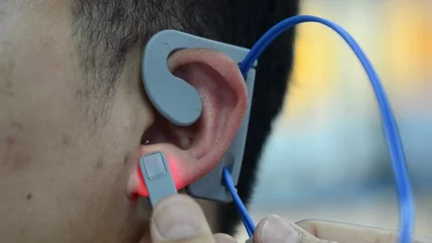Close-Up: Man Getting a Hearing Device Fitted Stock Footage 284023293