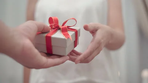 Close up man give the gift box to his girlfriend Stock Footage 147344327