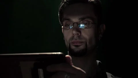 Close up of man in glasses browsing internet on smartphone Stock Footage 117165463