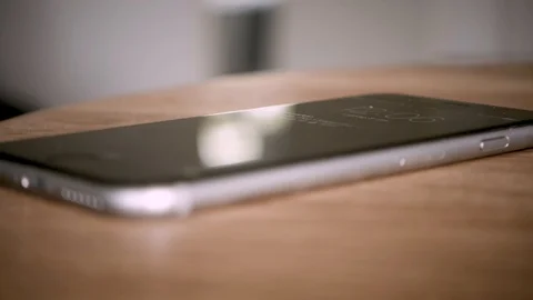Close-up Of A Man Grabbing Phone From Table Vídeo Stock 127036088