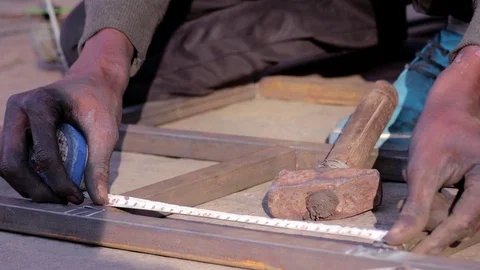 Close Up Of Man Hammering And Measuring Metal Parts In Workshop. Stock Footage 113124160