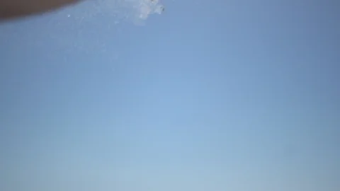 Close man hand at the beach, holding beach sand and open slowly Stock Footage 100166549