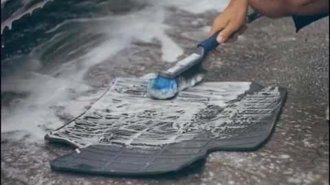 Close up of man hand brushing car carpet Video stock 117112668