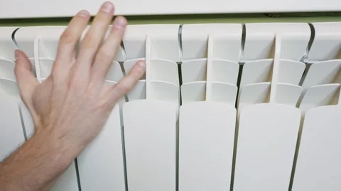 Close Up Of Man Hand Checking Temperature Of Central Heating Radiator Stock Footage 329484435