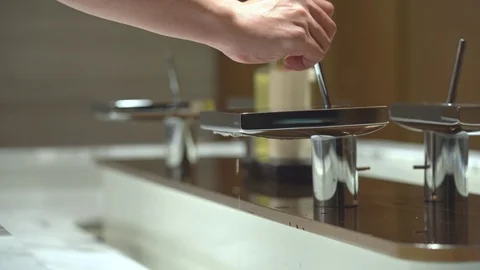 Close up man hand closing faucet 動画素材 122992453