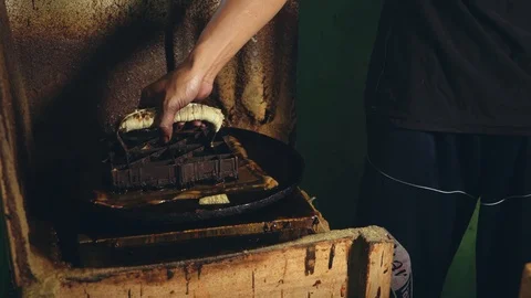 Close up man hand dipping cap in wax Stock Footage 89001649