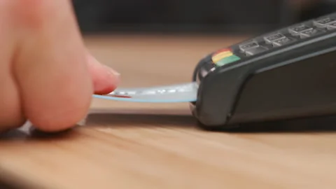 Close up man hand inserts credit card into the pos terminal and enters pin code Stock-Footage 153074783
