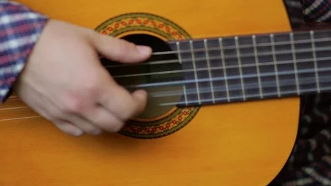 Close up of man hand playing classic guitar. Video stock 77084237