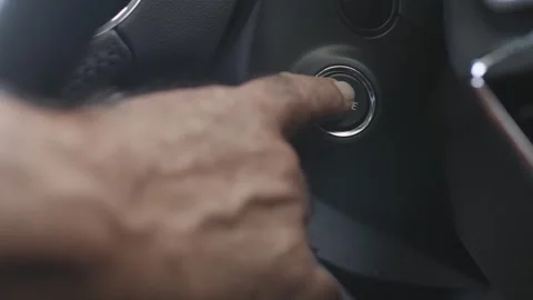 Close Up Man Hand Pressing Start Engine Stop Button In Modern Car 4K Stock Footage 325778591