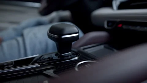 Close up man hand shift automatic transmission of expensive premium car inside Stock Footage 245263807