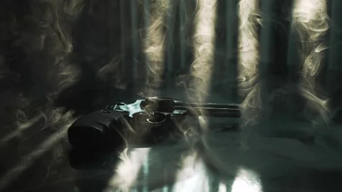 Close up man hand throws a revolver gun on the table. Backlight by dramatic 스톡 동영상 292949276