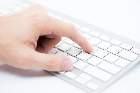 Close-up of man hand typing on keyboard Stock Photos