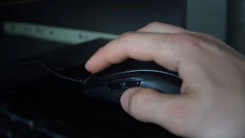Close-up of a man hand uses mouse. Guy arm clicks on the mouse buttons close up Stock Footage 126093006