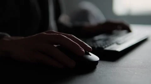 Close-up of man hand using a computer mouse in home office setup, highlighting Stock Footage 306648830