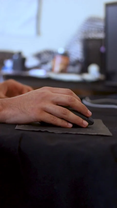 Close-up of Man Hand Using Computer Mouse on Desk Mat in Workspace Stock Footage 340294794