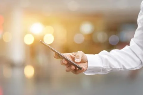Close up of Man hand using mobile smartphone. Idea for business communication Stock Photos