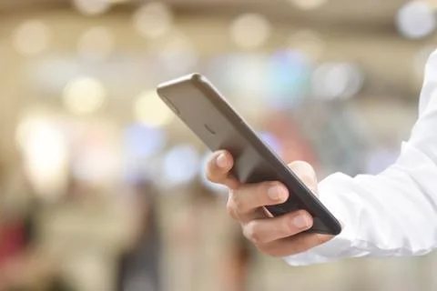 Close up of Man hand using mobile smartphone. Idea for business communication Stock Photos