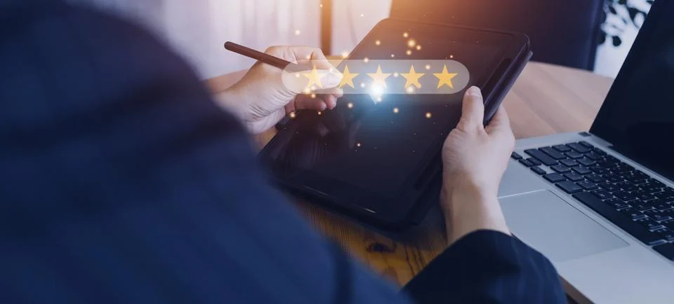 Close up Man hand using smartphone with popup five star icon for feedback r.. Stock Photos