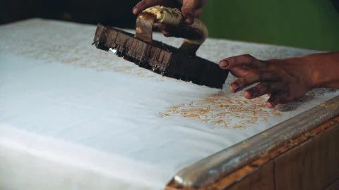 Close up man hands applying wax to make batik Stock Footage 89032030