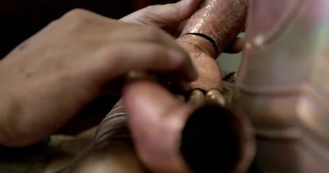 Close Up Man Hands Beautiful copper sculpture Stock Footage 96544945