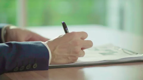 Close up man hands in blue suit signing document slowmotion 100fps Video stock 156029295