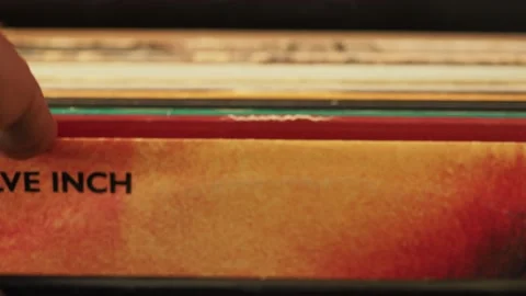 Close up man hands browsing vintage vinyl records at home. Searching Stock Footage 172509939