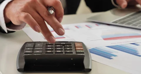 Close up Man hands calculating number, data, graph, chart audit planning account Stock Footage 234176515