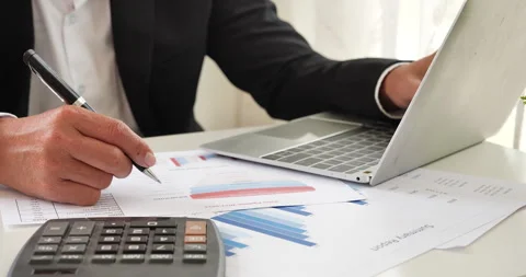 Close up Man hands calculating number, data, graph, chart audit planning account Stock Footage 267779942