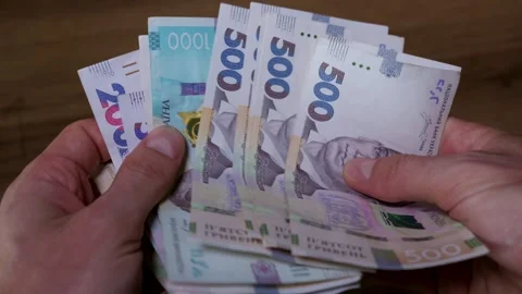 Close Up of Man Hands Counting Five Hundred Ukrainian Hryvnia Banknotes Stock Footage 339197605