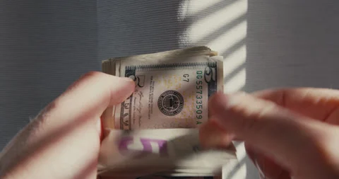 Close-up of man hands counting money five dollar bills. Stock Footage 323131728