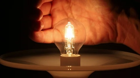 Close Up Man Hands Covering Light Bulb Stock Footage 116716669